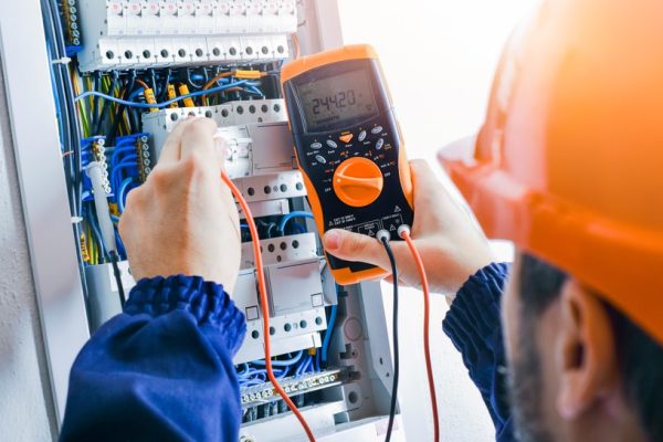 Electrician,Installing,Electric,Cable,Wires,And,Fuse,Switch,Box.,Multimeter